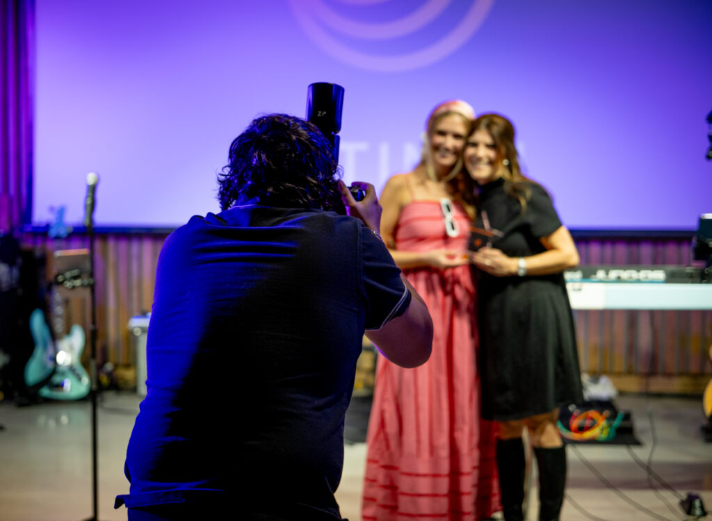 Event photographer photographing guests.